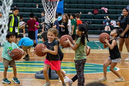 Children play basketball during Triton Athletic Sports Camp