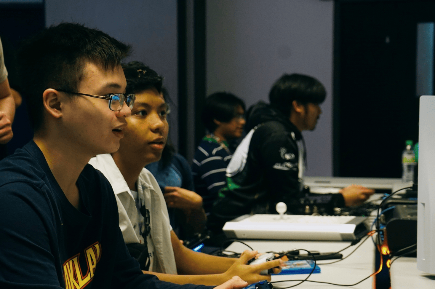 Male students participating in a Triton Esports event during Tech Fest 2023
