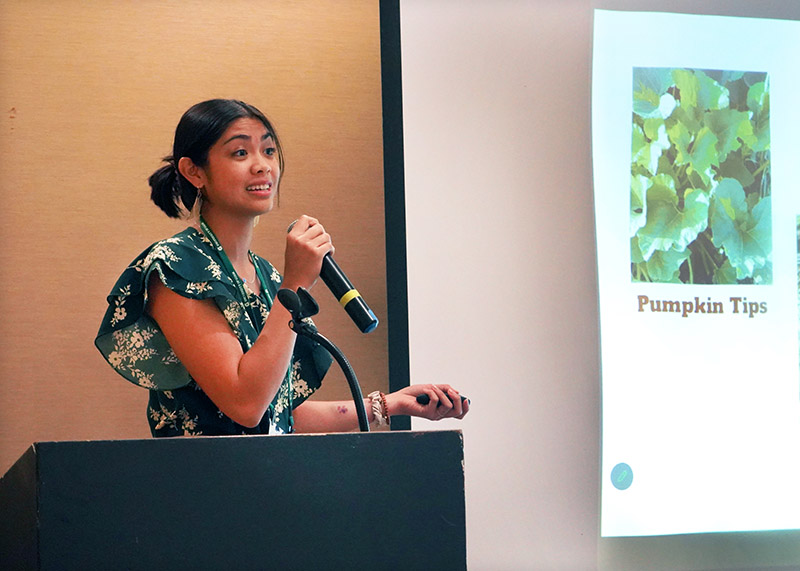 Photo of Stephenie Santos giving a presentation