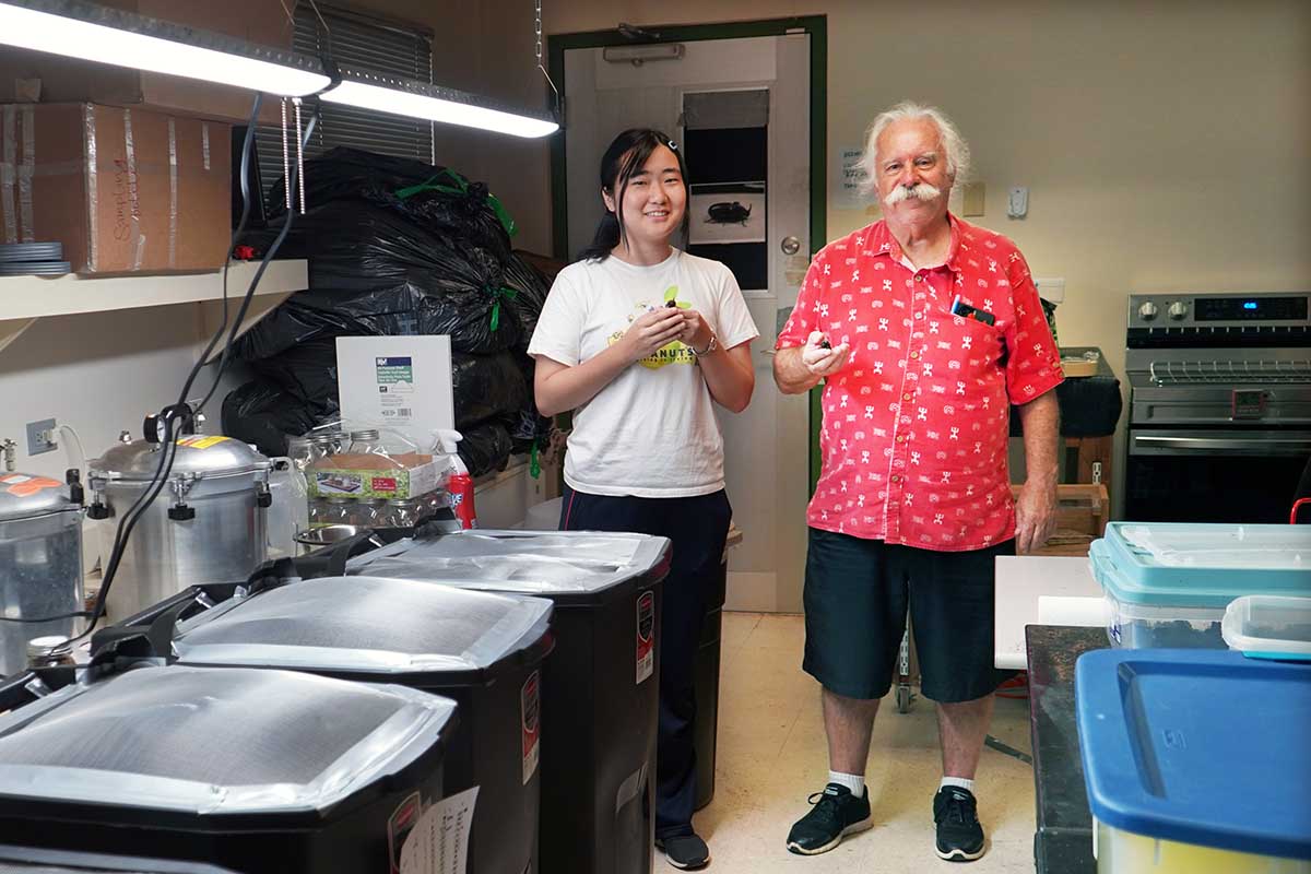 Photo of Dr. Aubrey Moore and Tokyo University grad student Mayuho Yamauchi in a lab