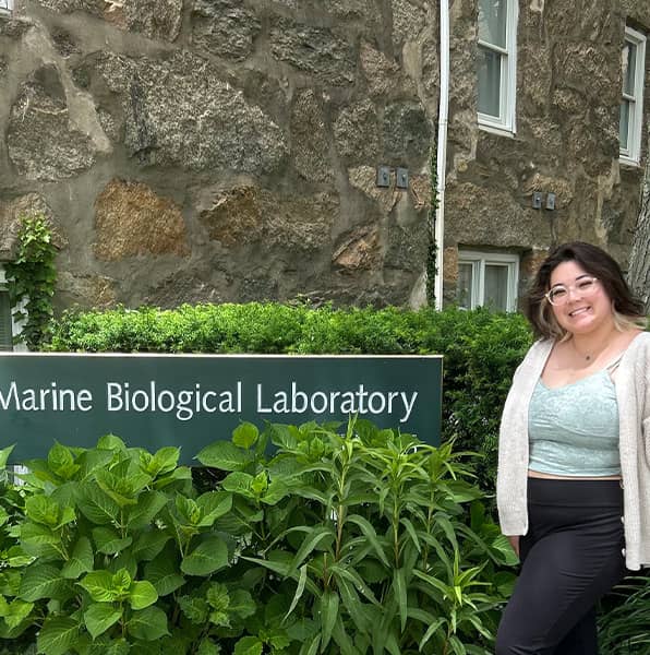 Gabriella Prelosky poses in front of Marine Biological Laboratory