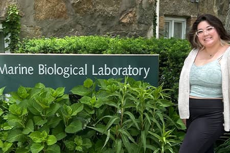 Gabriella Prelosky poses in front of Marine Biological Laboratory