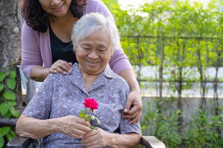 Image of caregiver taking care of patient with dementia