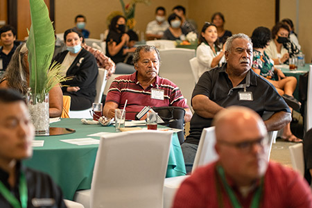 An audience of farmers and government agency representatives listen to the keynote speaker at the Guam-based Farmer Focus Conference on June 17, 2022. 