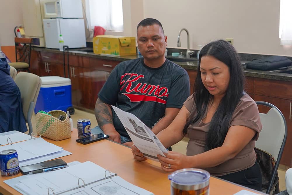 Photo of Saipan pig farmers Simon and Crystal Deleon Guerrero