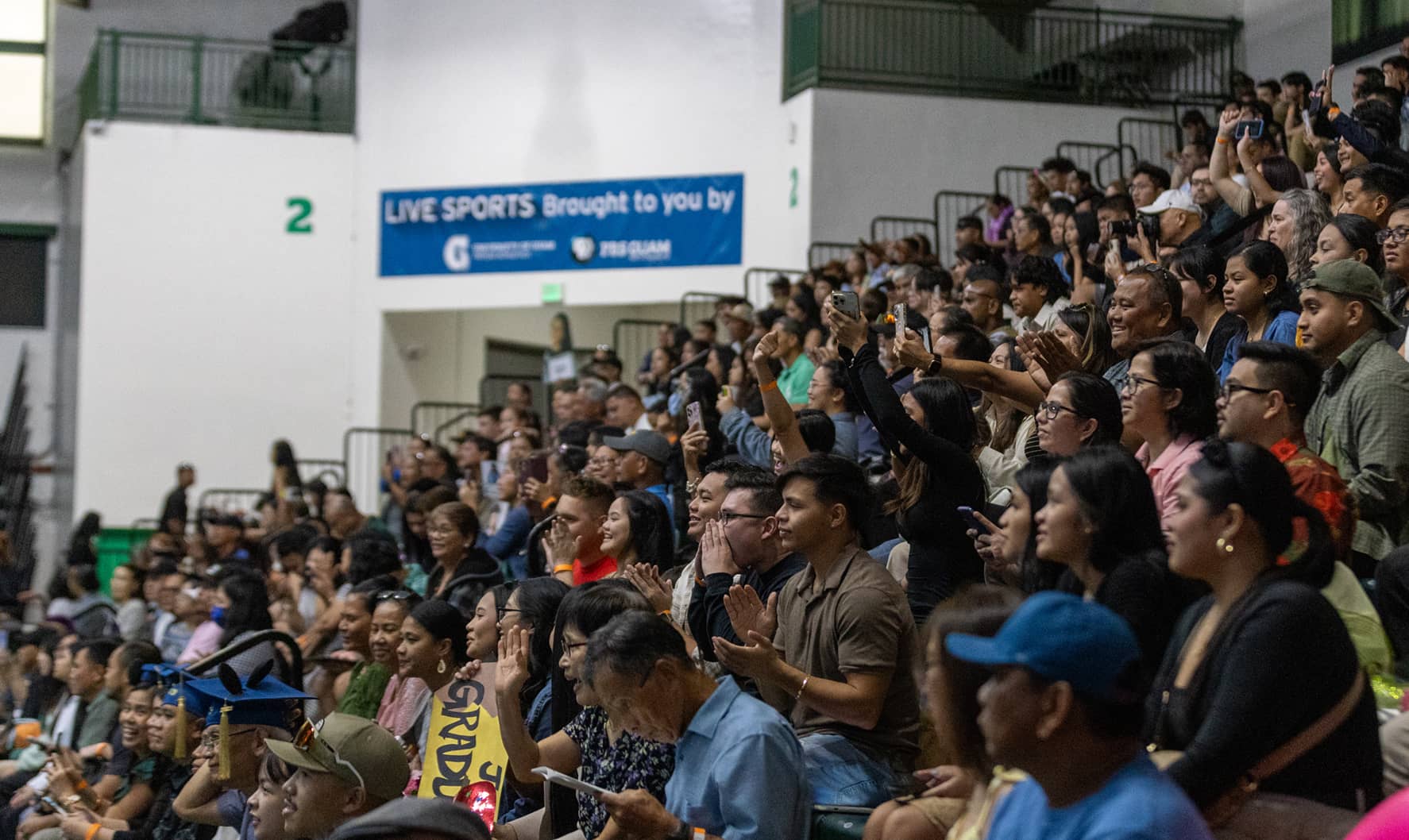 Photo of the crowd cheering for the graduating students during the Fanuchånan 2023 commencement