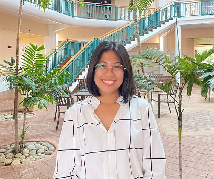 Dona Silang poses for a photo at UOG Business building.