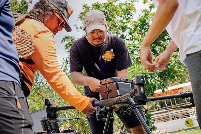 UOG Drone Corps members set up drone for flight during mission at Valley of the Latte Adventure Park in Talo’fo’fo