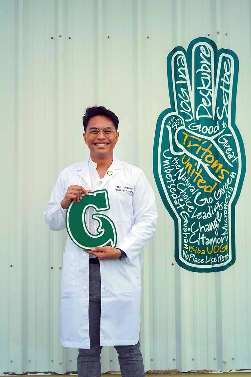 Photo of Nicko Inocencio holding the Big G logo