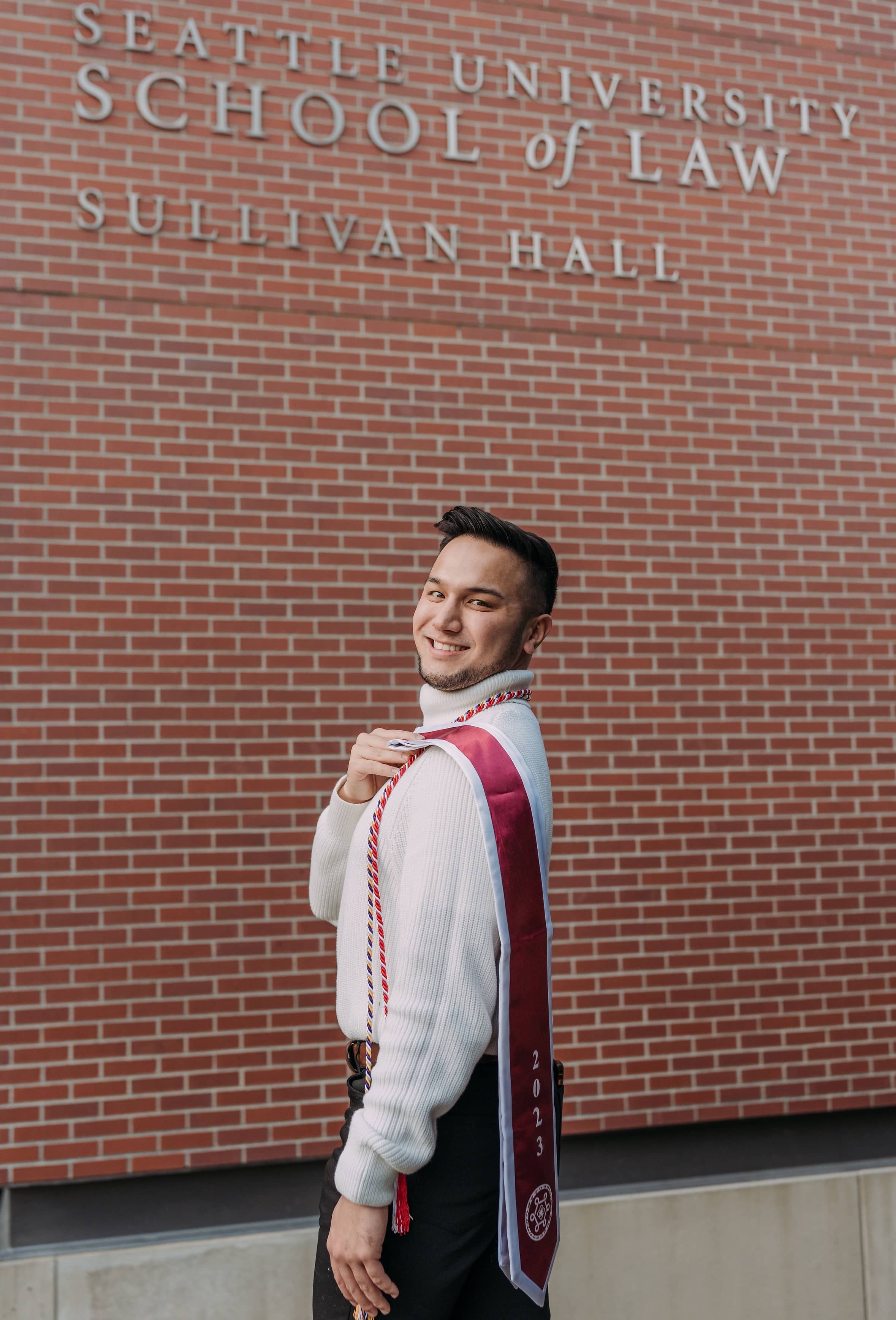 Travis Aguon in front of the Seattle State University School of Law Sullivan Hall.