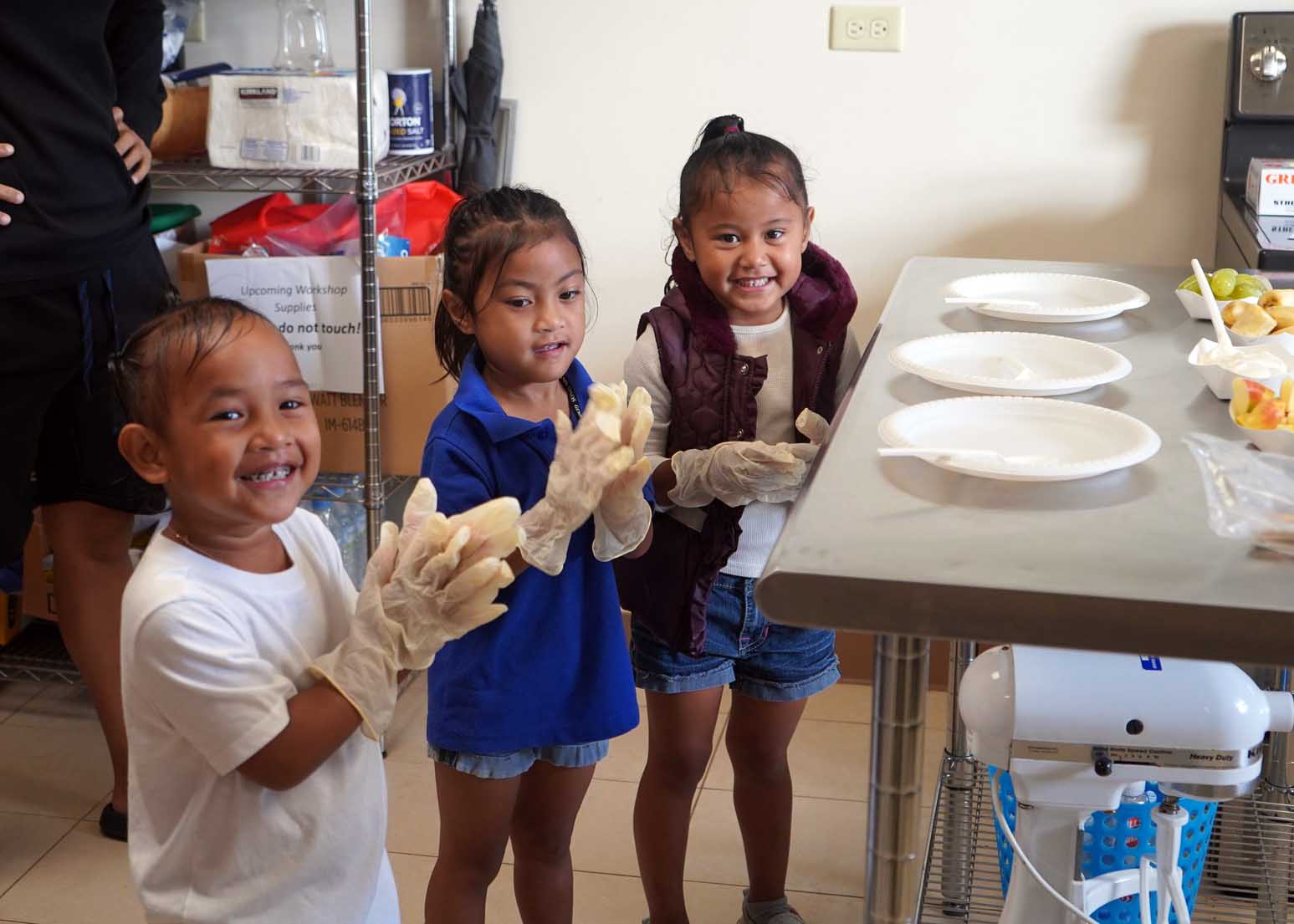 Photo of three girls preparing a healthy snack