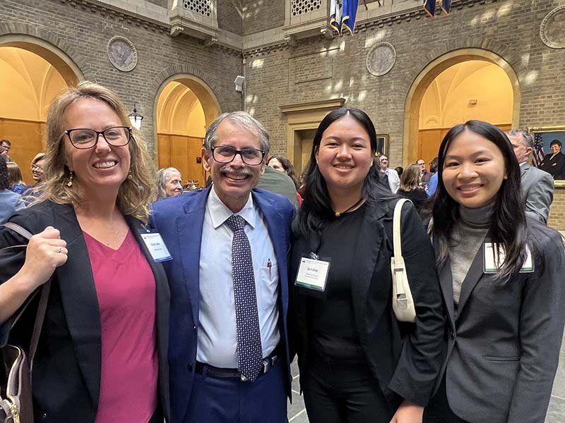 UOG agriculture majors Jamilee Cruz and Charlene Badajos with NIFA Director Manjit Misra. 