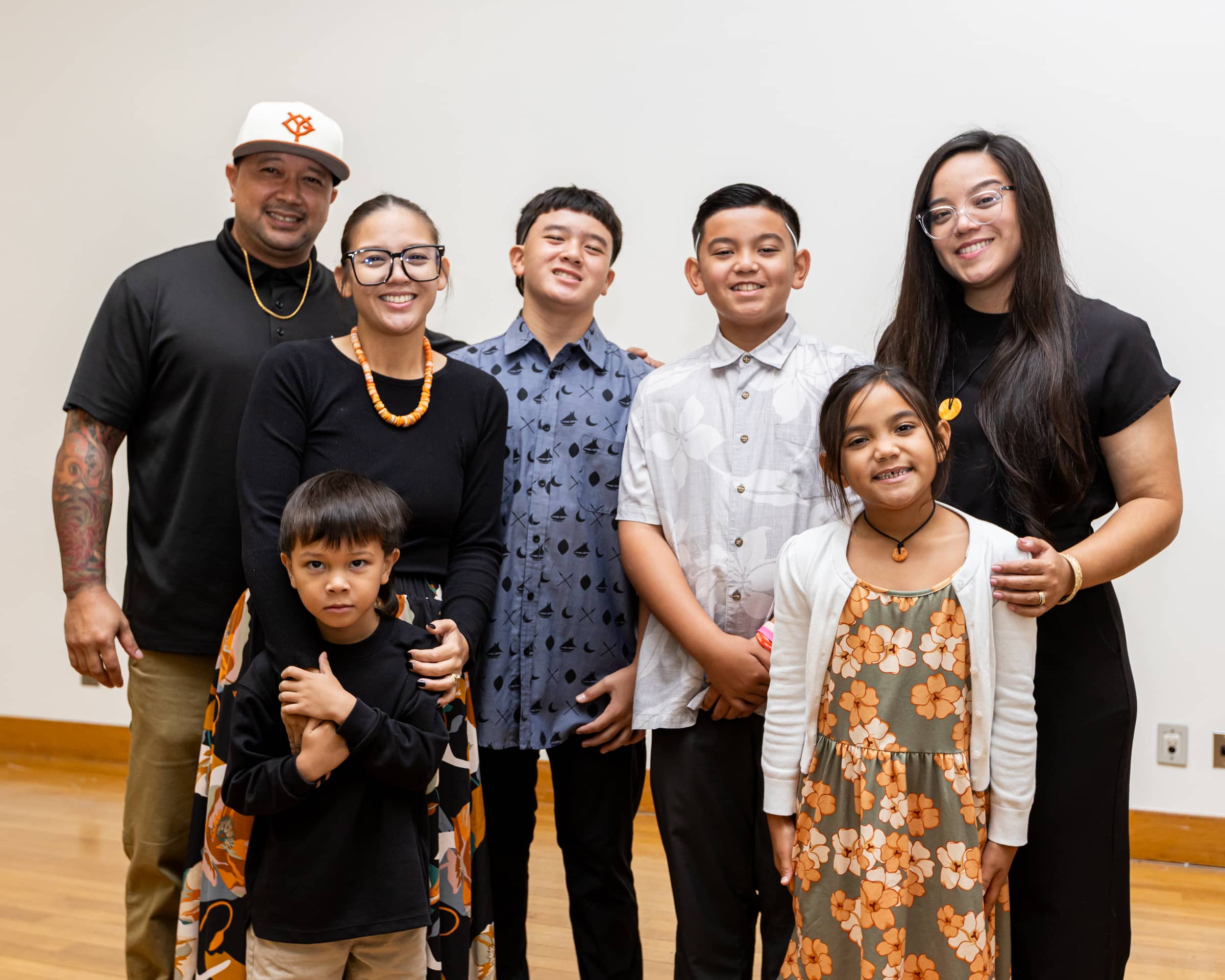 Drew Ann Laguaña (second from left, back row) and Jerusa Laguaña (far right, back row), daughters of the late Andrew T. Laguaña, pictured with their families during the scholarship announcement ceremony. The sisters delivered heartfelt remarks honoring their father’s legacy. Photo courtesy of the University of Guam
