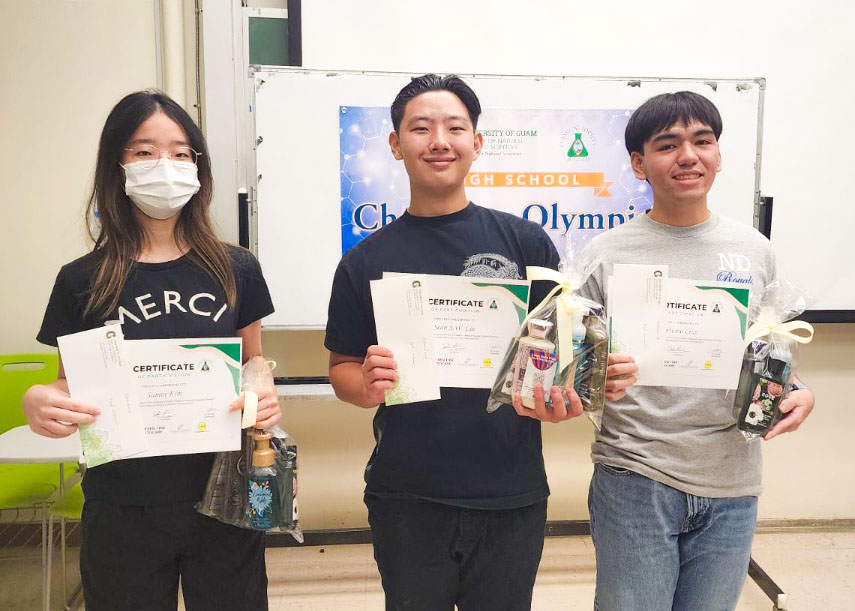 Photo of three winners holding certficates