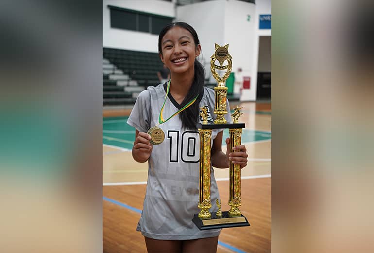 Guam Pro 1 3rd Place Winner poses with MVP Medal and trophy