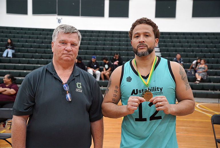 Joe Blas poses for photo with UOG Athletic Director Doug Palmer