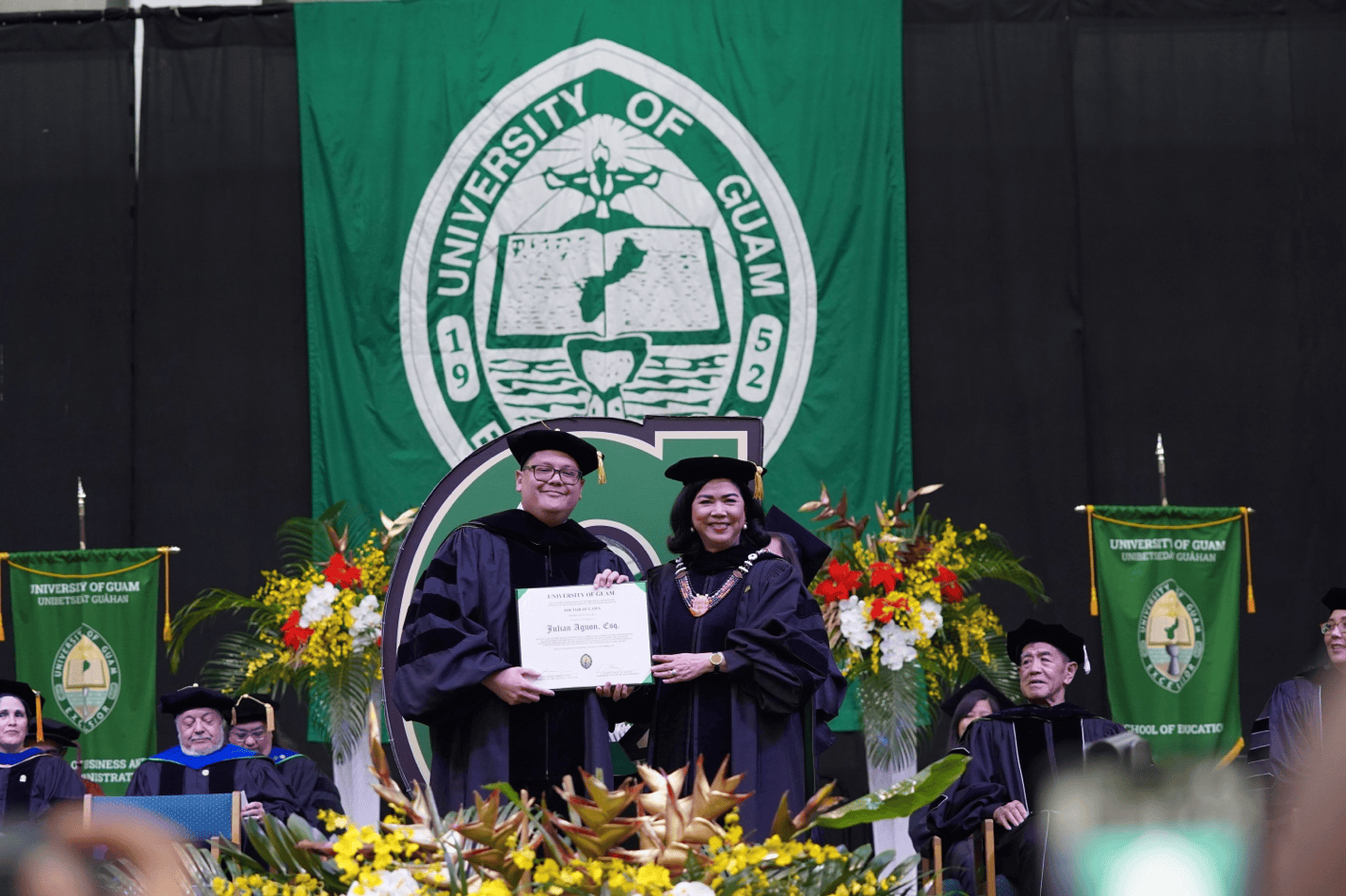 Julian Aguon is awarded an honorary Doctor of Laws degree by President Anita Borja Enriquez