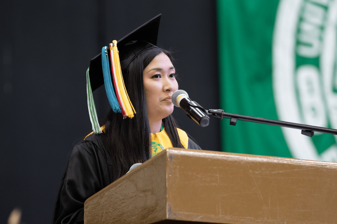 Valedictorian Keana Ardiente speaks at podium
