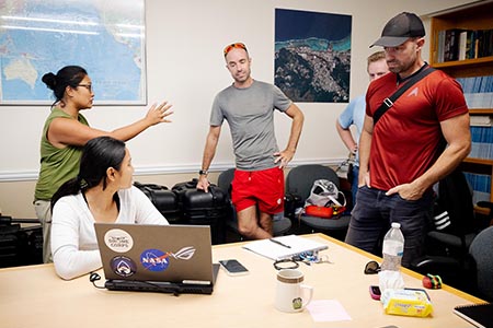 Dr. Romina King talking with graduate students