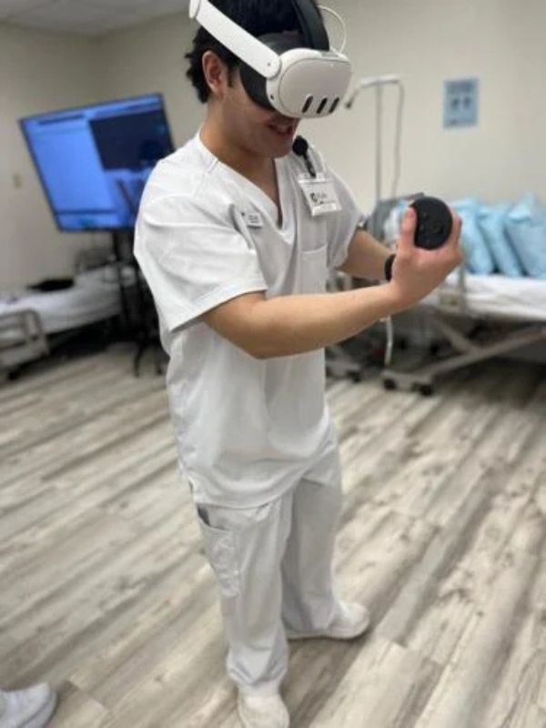 A UOG nursing student uses VR clinical technology.