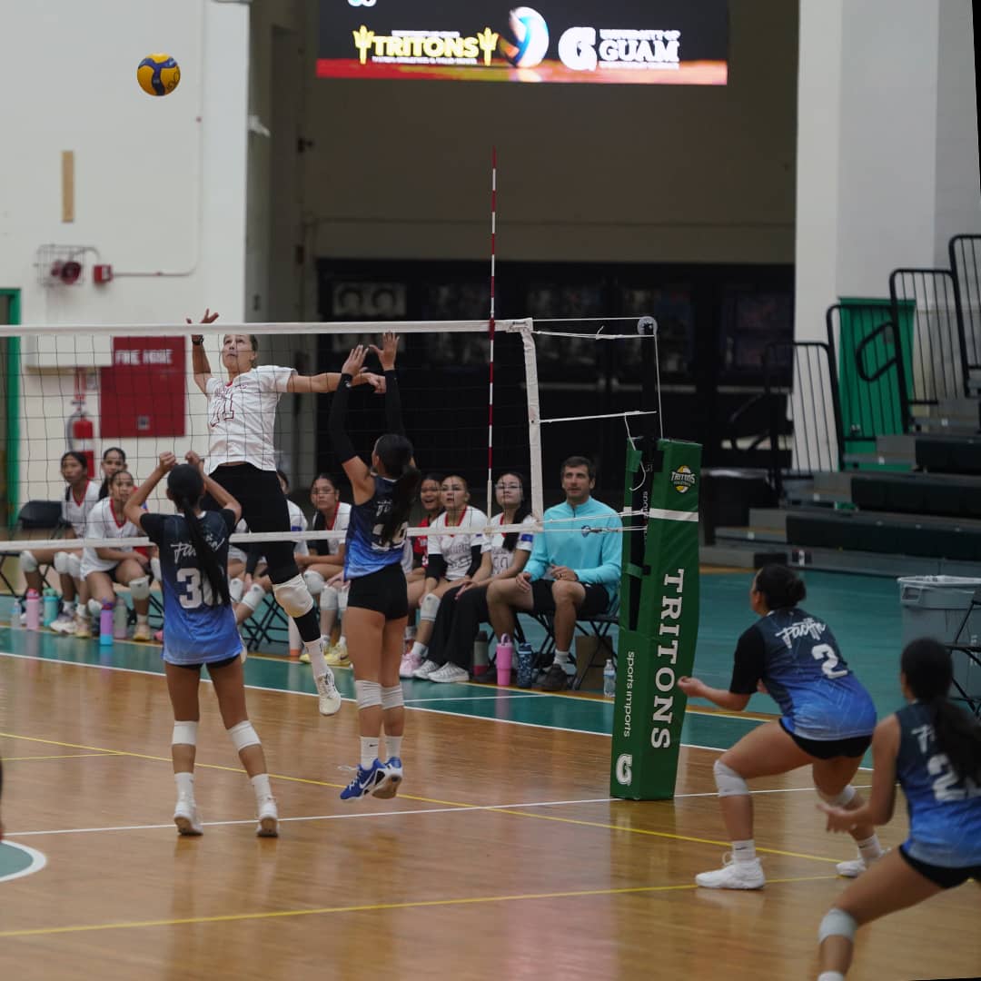 Coach Oksana Chernyshova spiking a volleyball