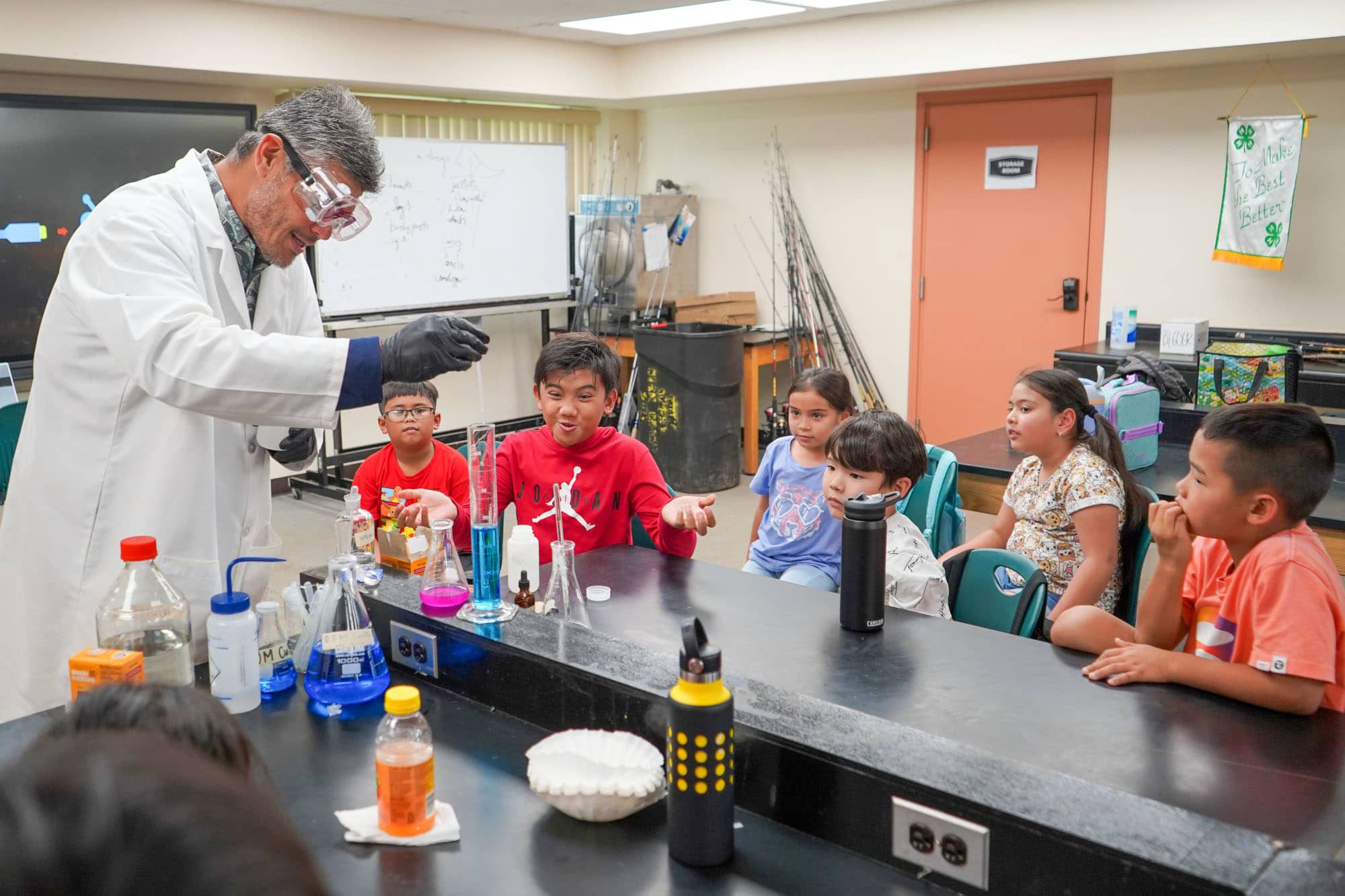 University of Guam chemistry faculty John Limtiaco demonstrates an experiment