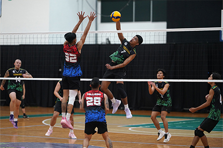 UOG Tritons Volleyball team in action