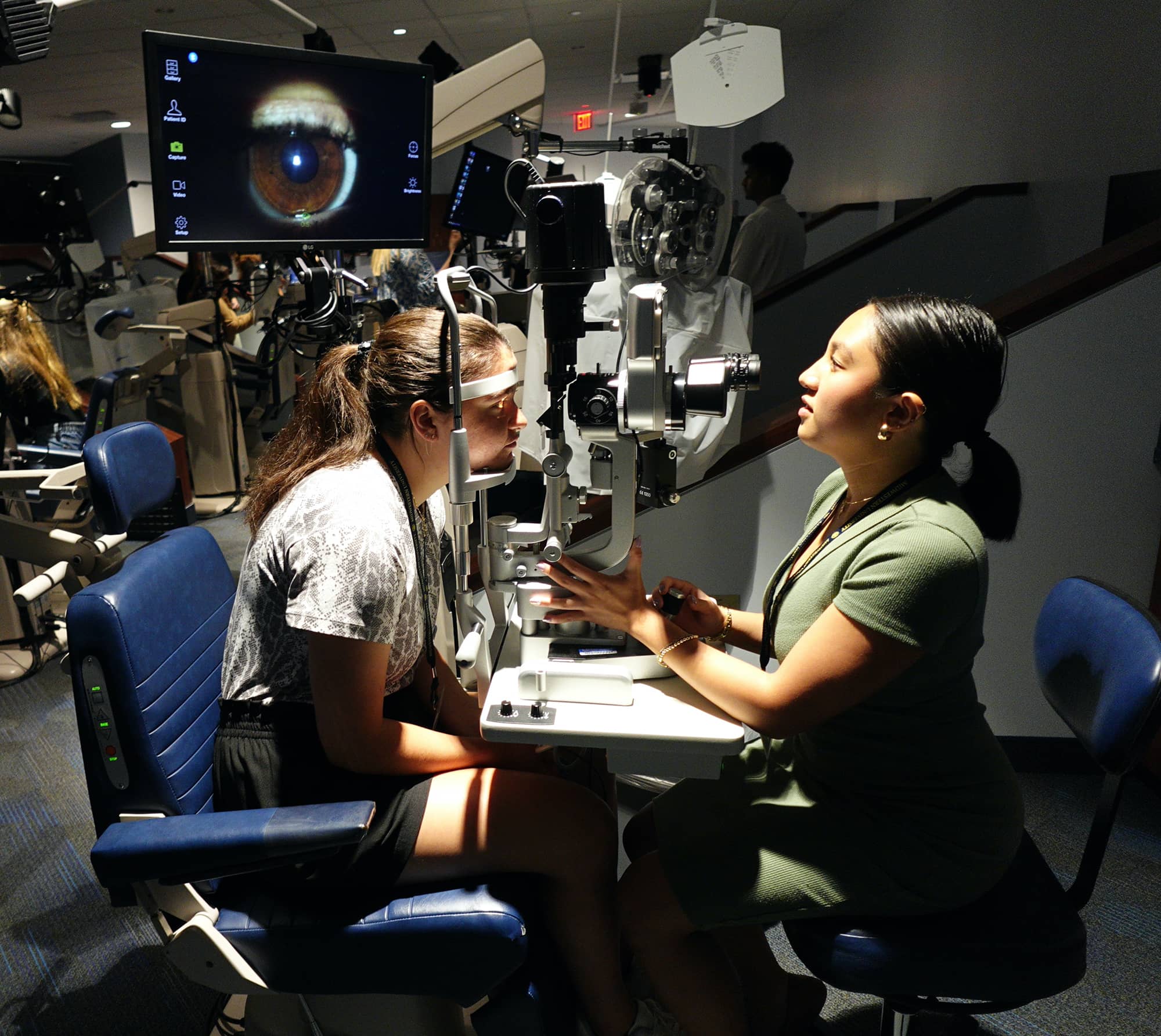 Kyra Dela Cruz examines eyes