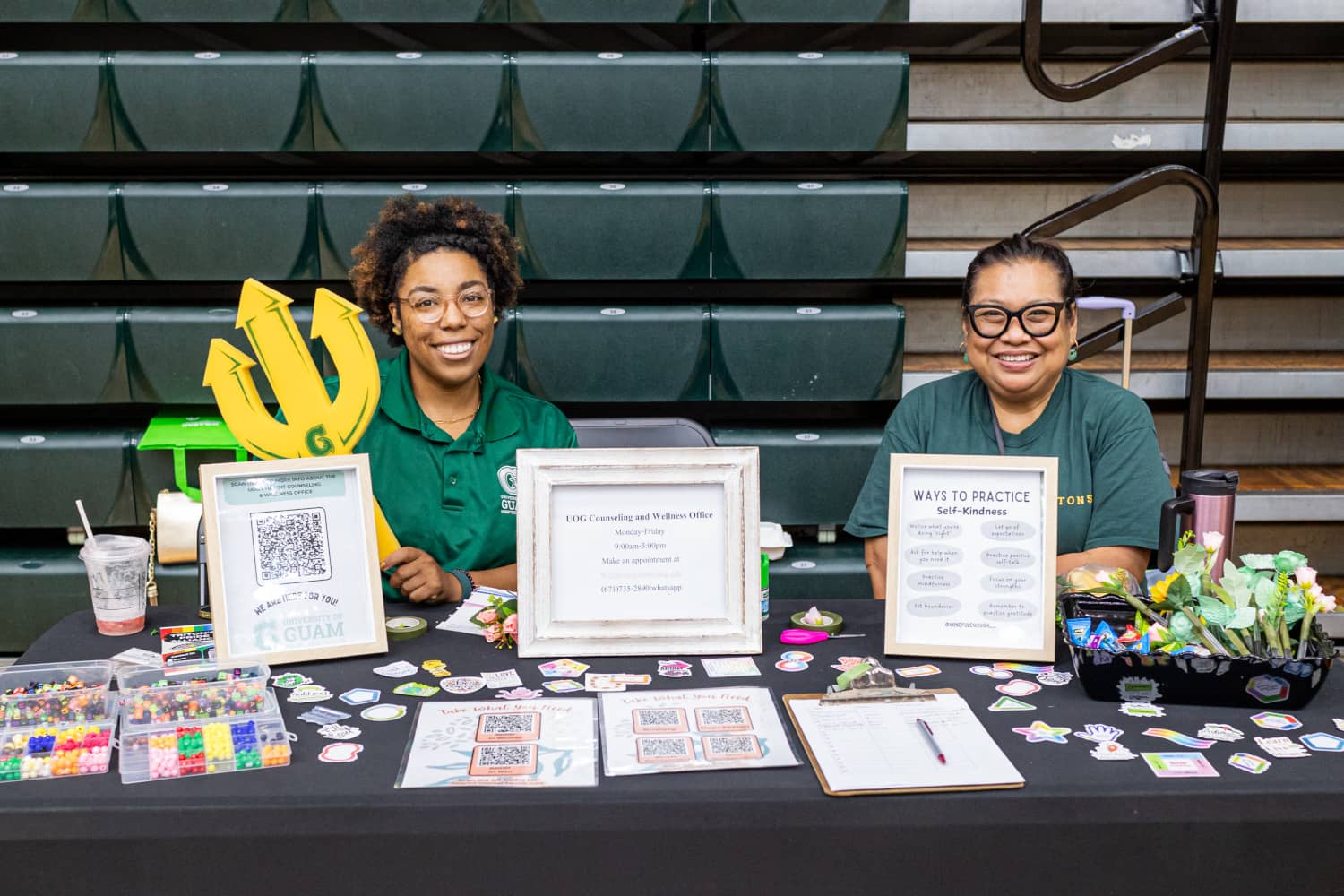 Venus Ituralde spreading awareness about mental health and self-kindness at a UOG outreach event.