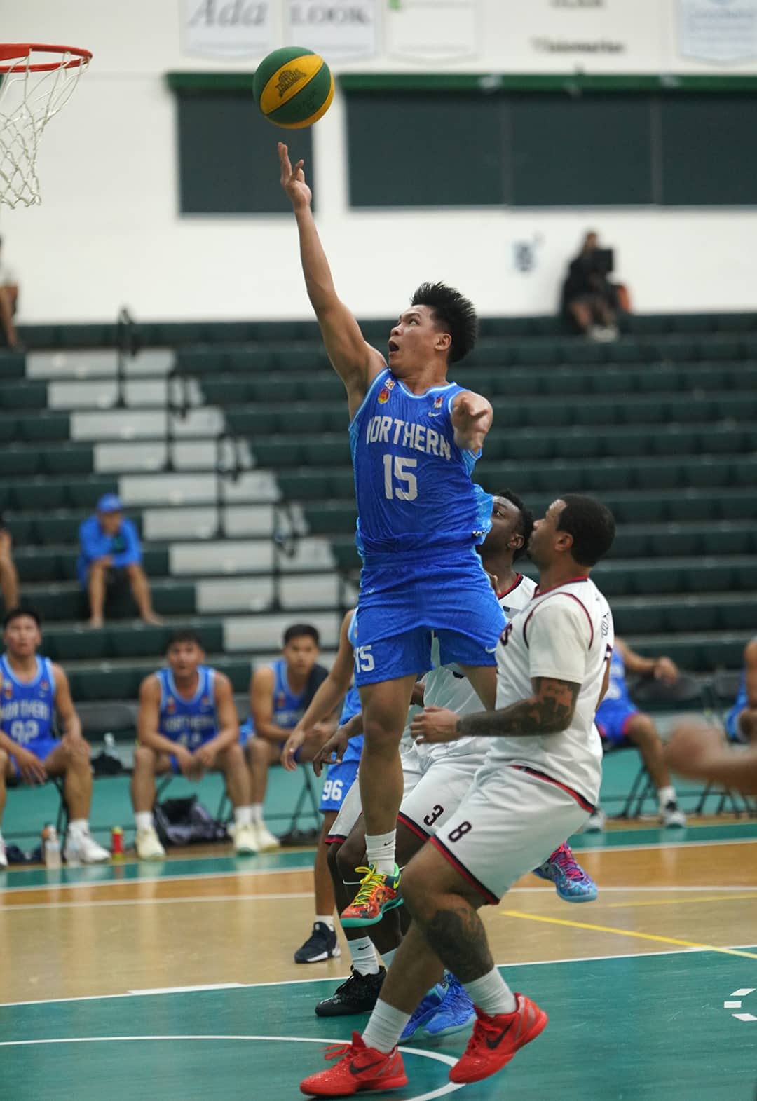 Number 15 of Northern Construction goes for a lay up