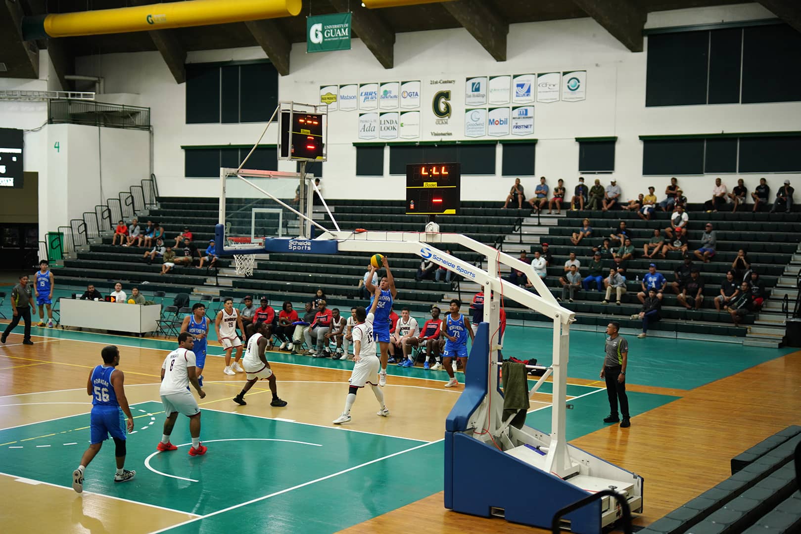 Number 94 of Northern Construction shoots a mid-range jumper