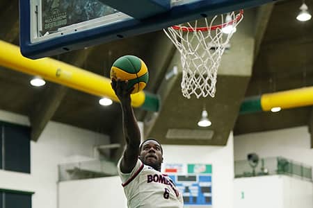 Number 6 of the KFC Bombers goes up for a lay up