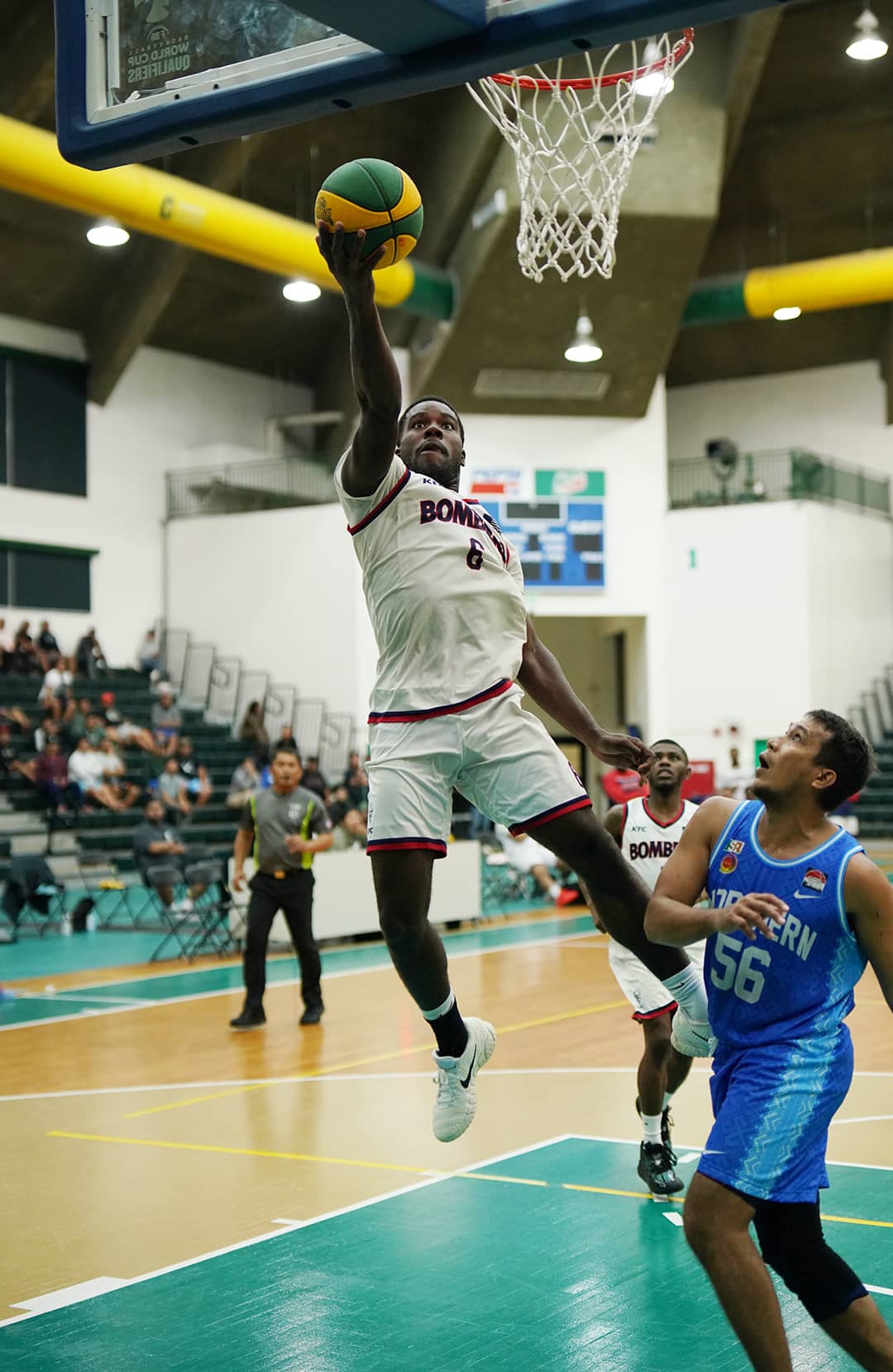 Number 6 of KFC Bombers goes for a lay up