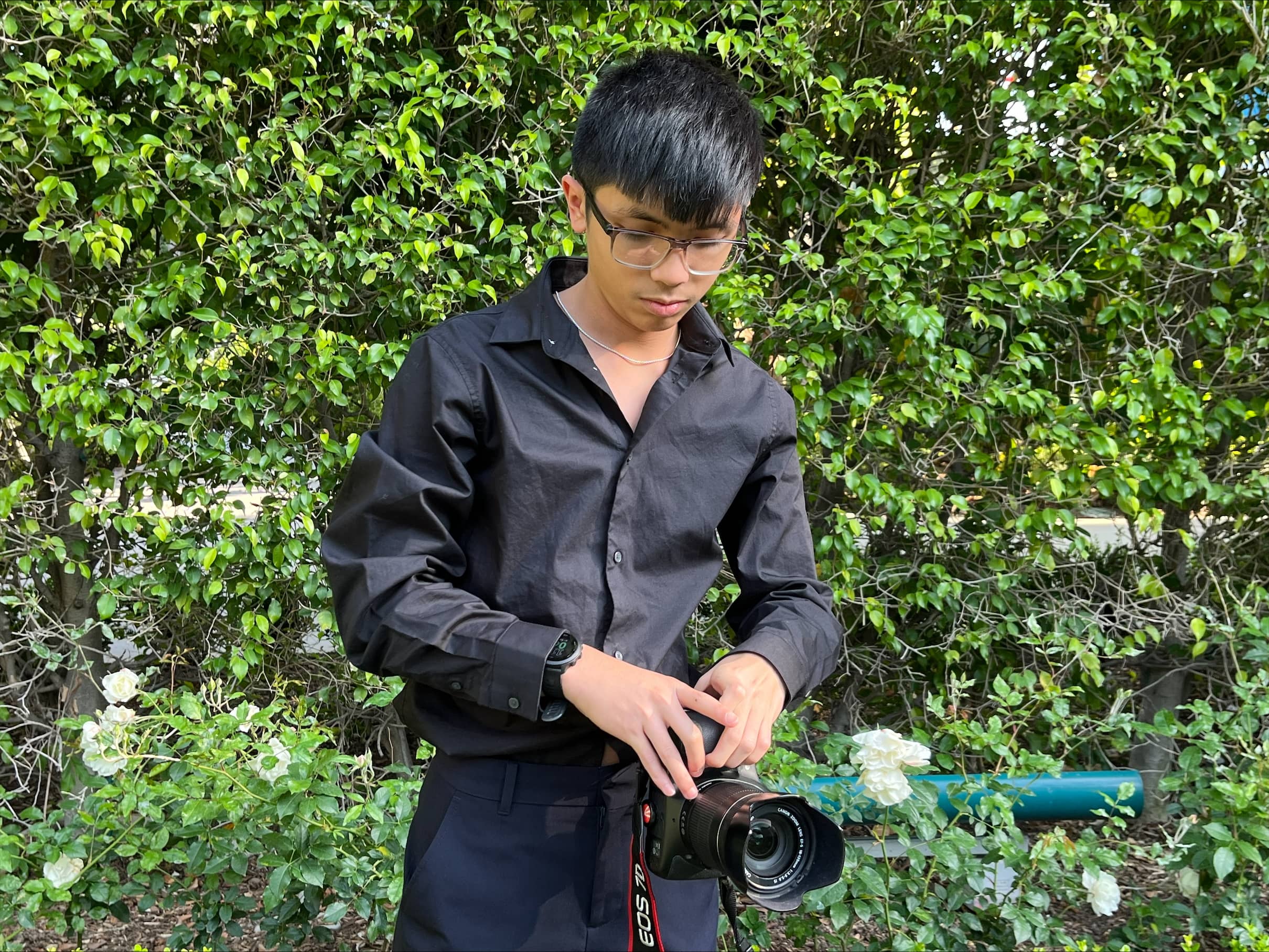 Ethan Dela Cruz holding a camera