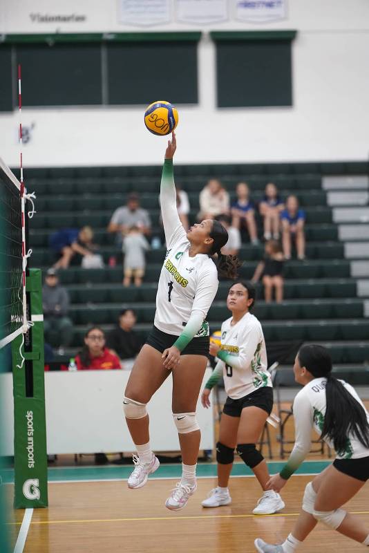 Lady Tritons is about to serve.