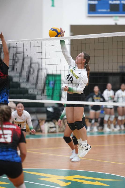 Lady Tritons is about to serve.