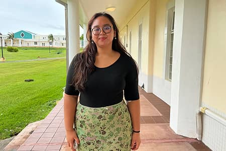 UOG senior Monica Cosico is a true “triple threat” in the performing arts—excelling in singing, dancing, and acting. As a Theatre and Communications double major, she has built an impressive résumé of performances, training, and behind-the-scenes work. From childhood choir to university productions, Cosico continues to refine her craft and inspire others to take the stage with confidence.