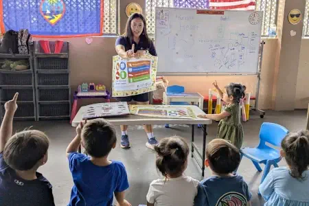 Katrina Macasaquit teaches the 5-2-1-Almost None curriculum to children at a child care center