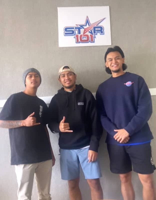  After a radio interview, Emann Adonay is all smiles with TJ Kinno and Jeddou Antonio