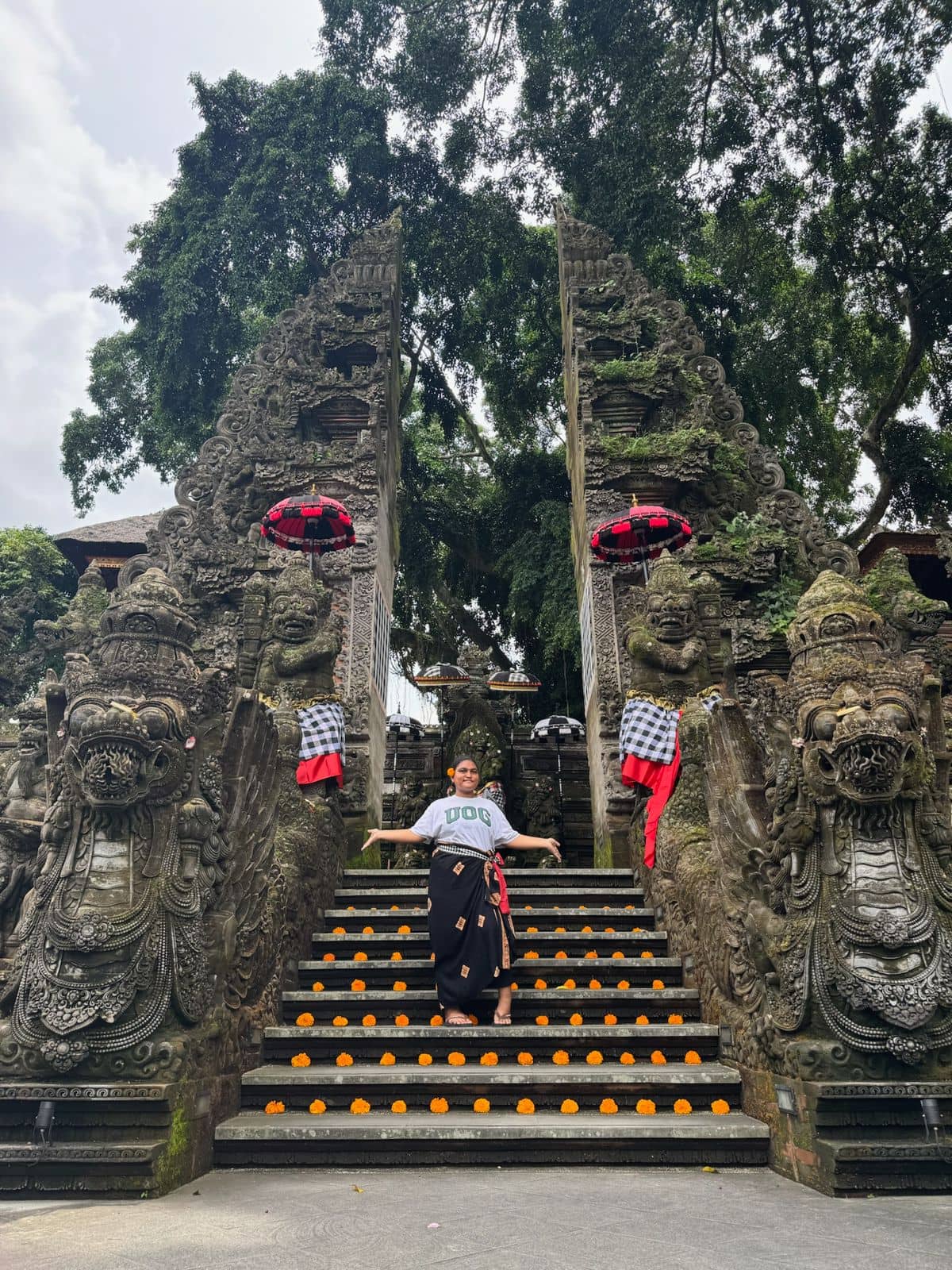 BrieAnndah Foruw stands at the gates of a sacred temple