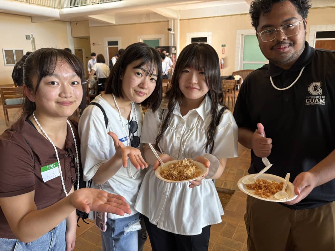 Iwata Higashi High School students posing with coconut candy
