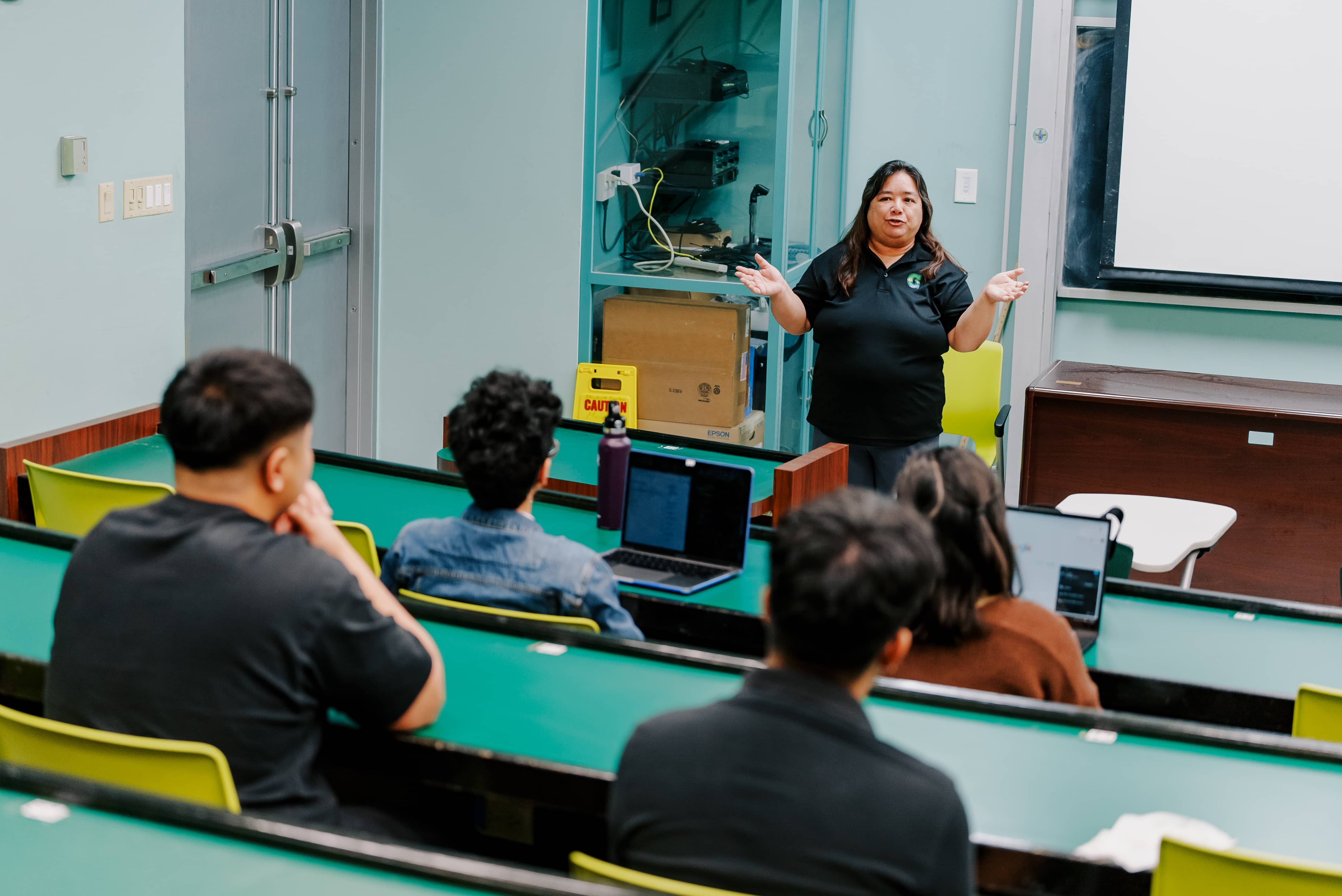 Leslie Aquino, Ph.D welcomes students during the program orientation