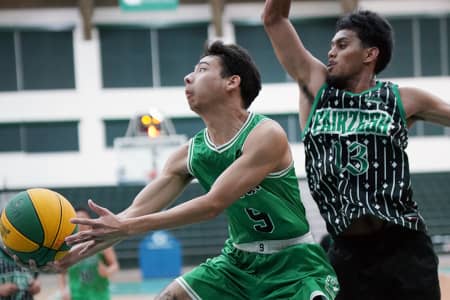 Fairzesh closed out the Triton Men’s Basketball League regular season with a decisive 106–68 win over the UOG Tritons, leaving UOG winless at 0–7 heading into the playoffs. Strong performances from Rodman Simina, Manne Pillias, and Chris Conner powered Fairzesh’s dominant offensive showing, while the Tritons struggled to keep pace despite efforts from Rico Taitague and Javen Naputi. With the regular season winding down, UOG will enter the playoffs as the No. 8 seed and face the undefeated Guam National team on December 2. Final standings will be confirmed after Monday’s remaining games.