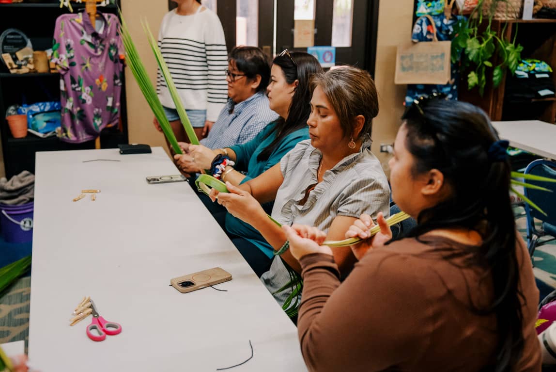 Participants in a weaving workshop 