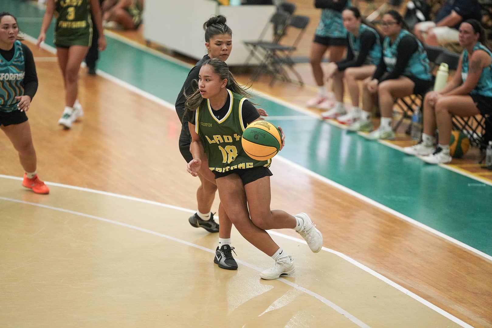 Mylie Navarro takes the ball and drives on JusForFuns