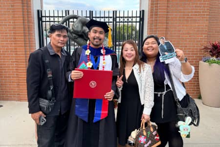 Nelmar J. Cruz (second from left) poses with his parents and sister