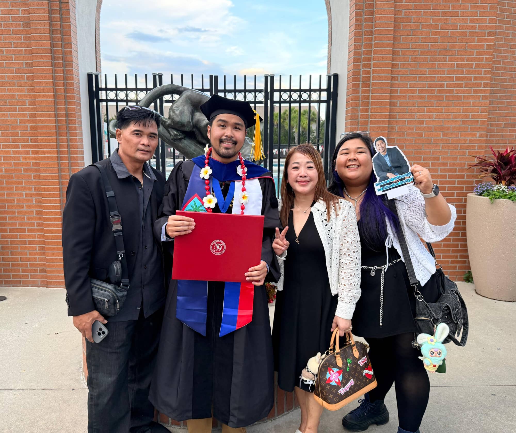 Nelmar J. Cruz (second from left) poses with his parents and sister
