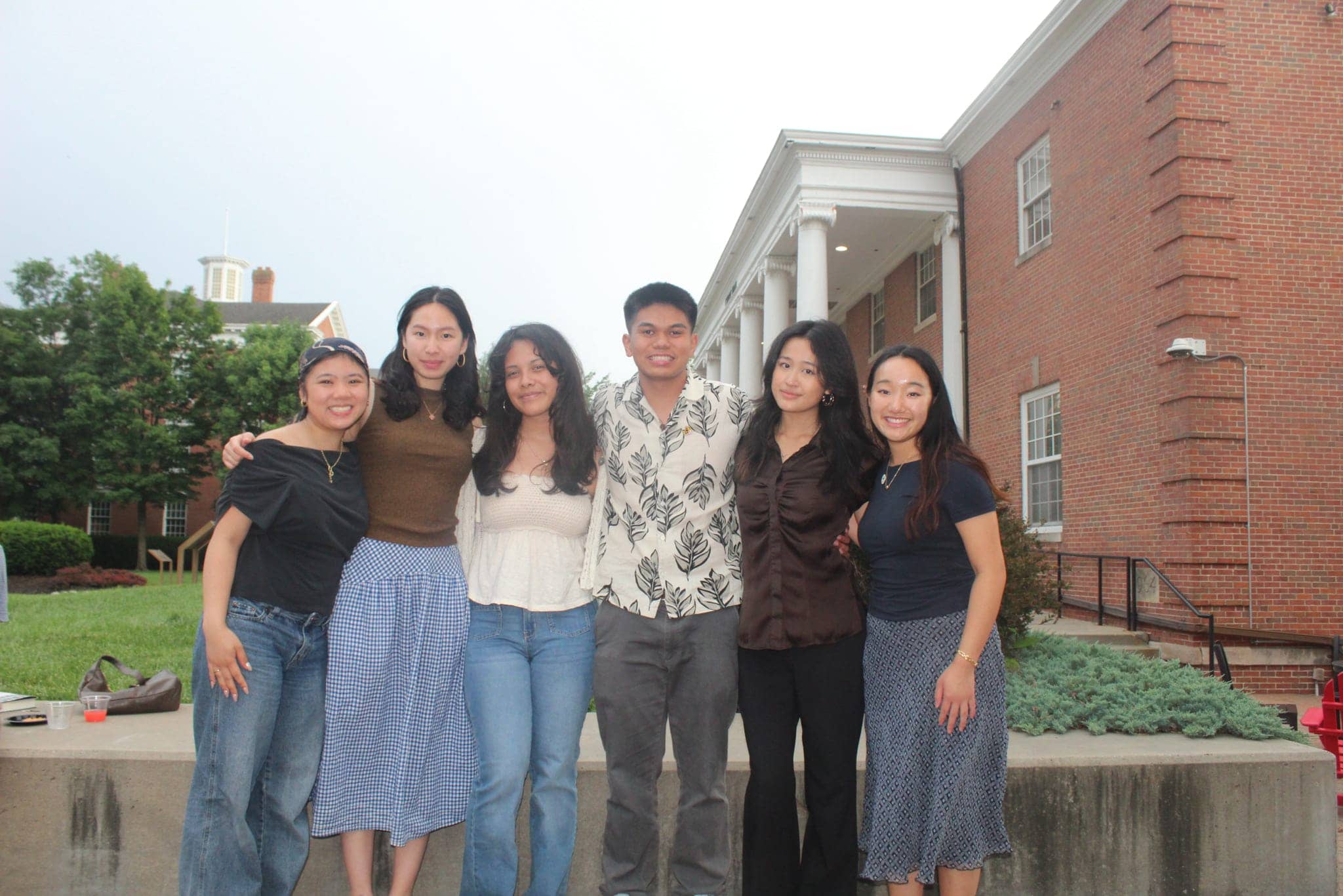 Caden Nathaniel Ong Poblete, center, joins fellow Asian American and Pacific Islander Truman Scholars