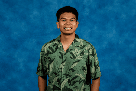 Smiling Young Man in Green Aloha Shirt